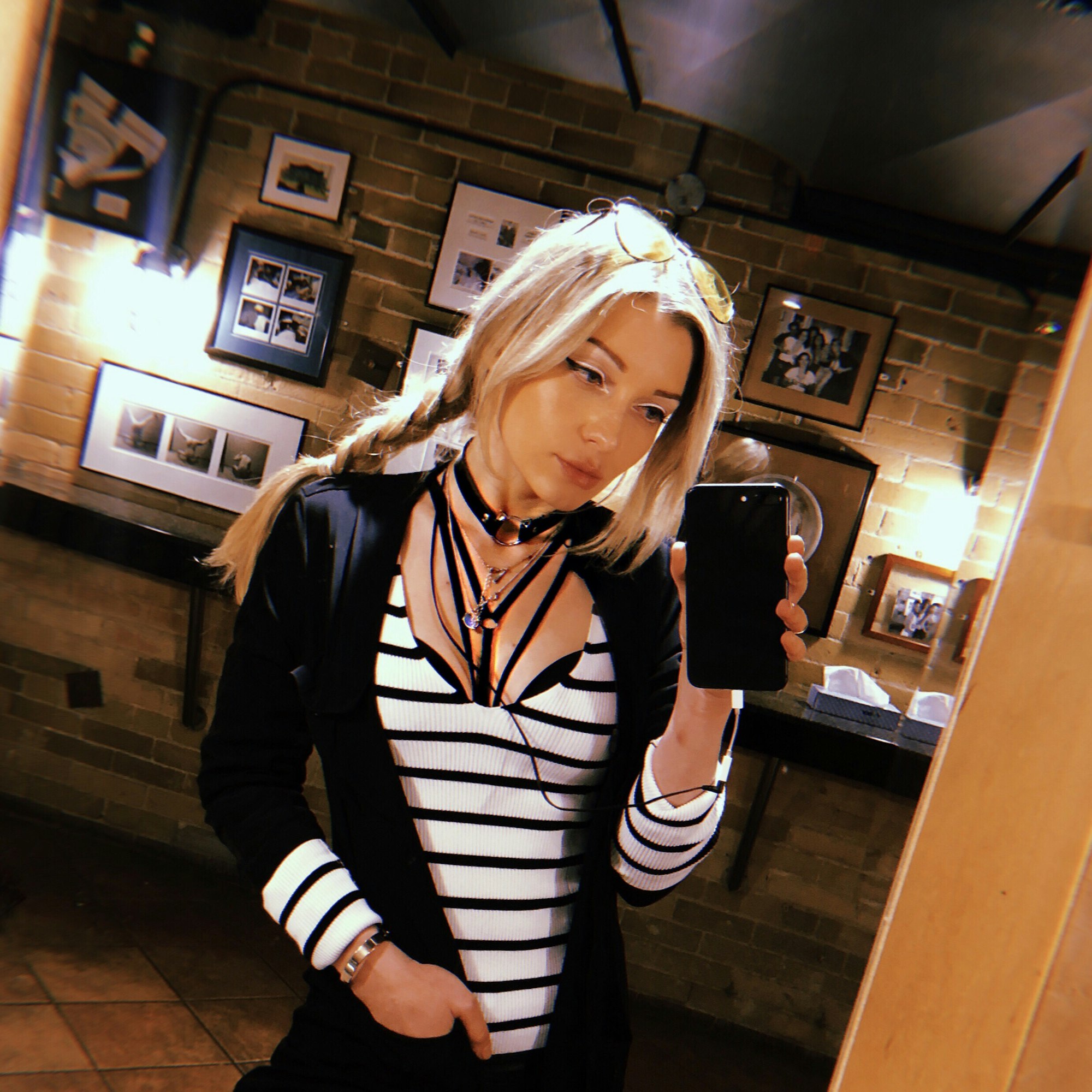 Beautiful blonde girl taking a selfie